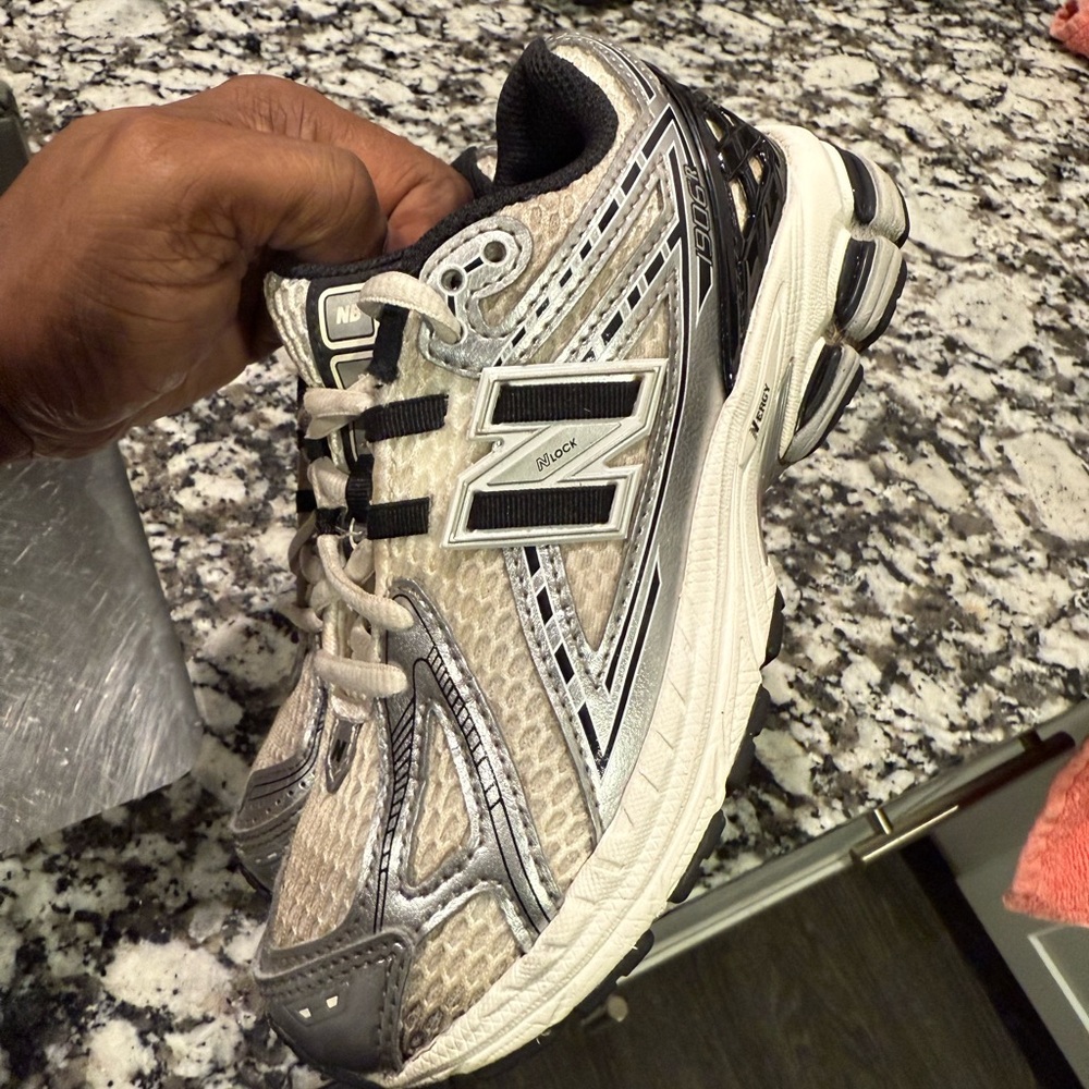 New Balance Silver and Black Sneakers